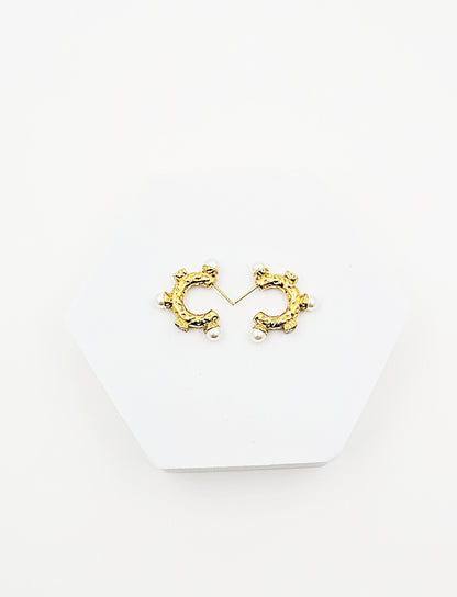 Irregularly shaped semi circular pearl diamond set with stainless steel gold plated earring